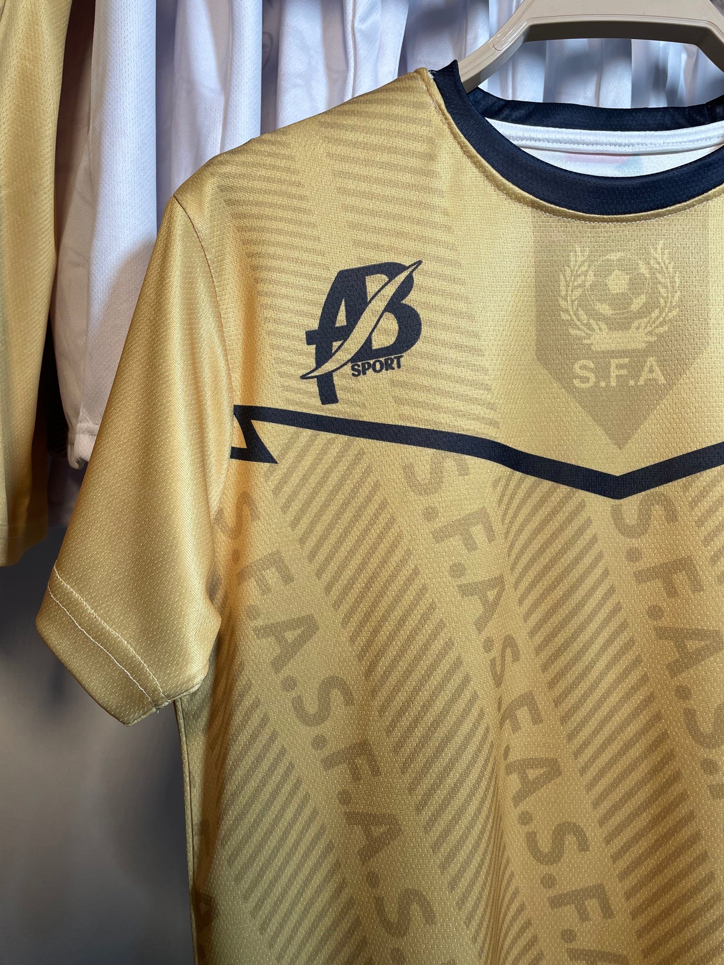 The yellow Sudanese national team T-shirt