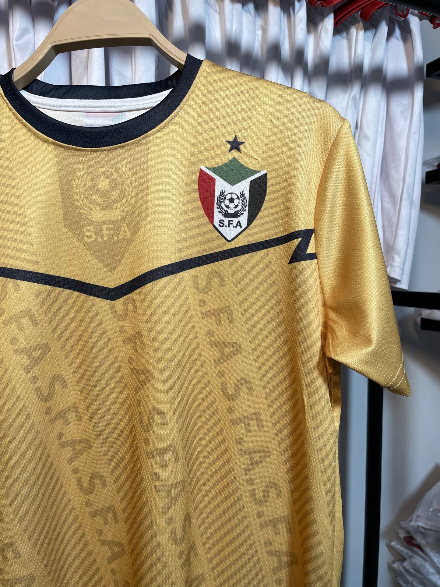 The yellow Sudanese national team T-shirt