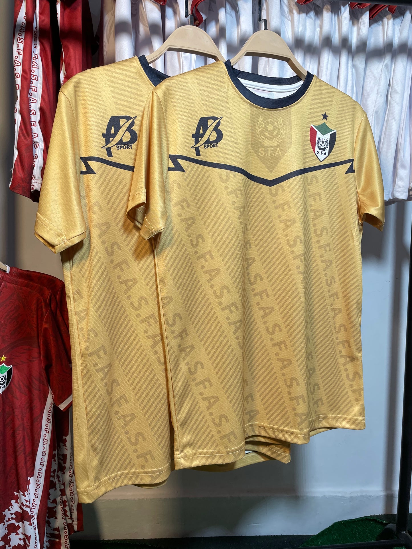 The yellow Sudanese national team T-shirt