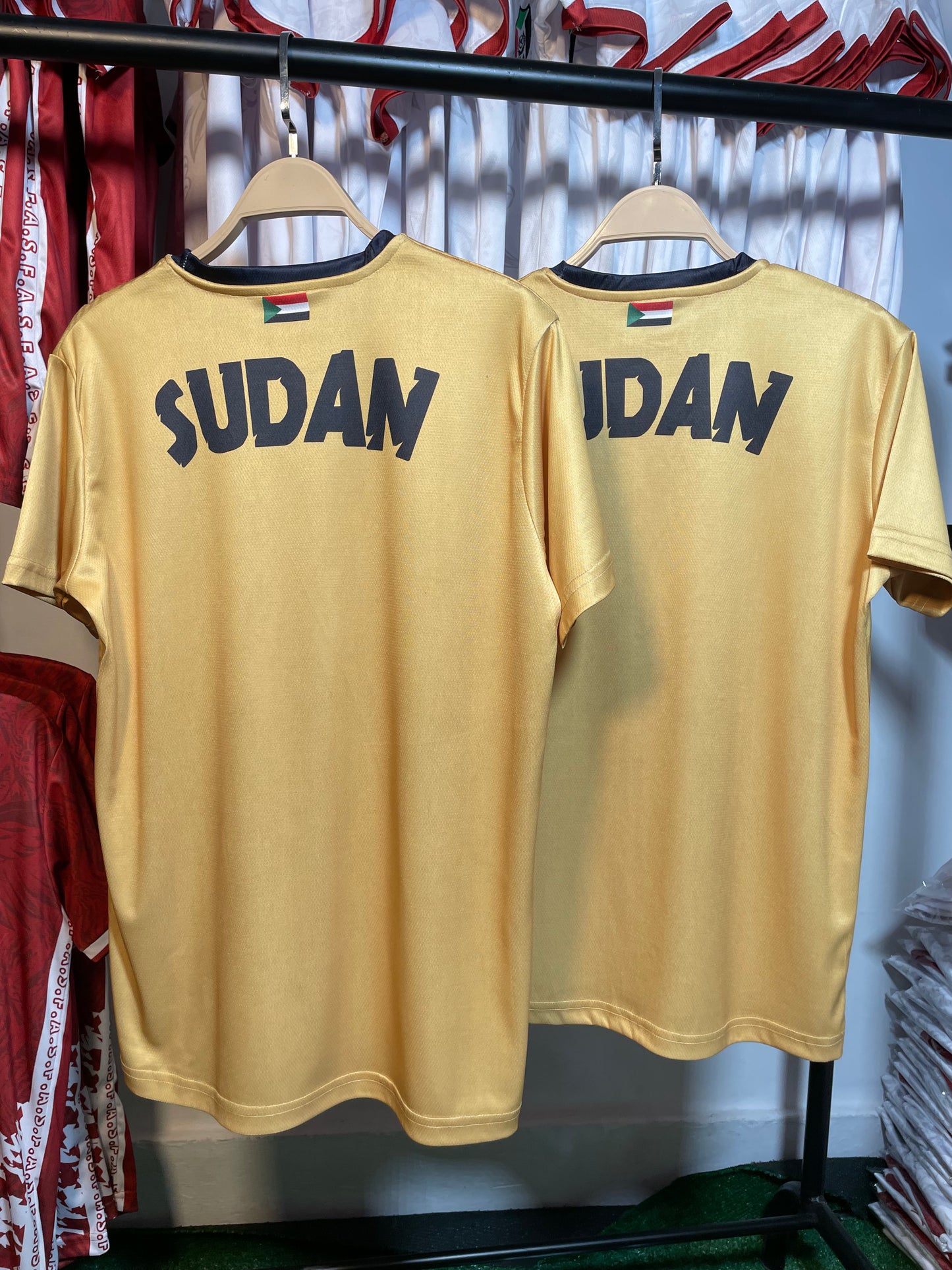 The yellow Sudanese national team T-shirt