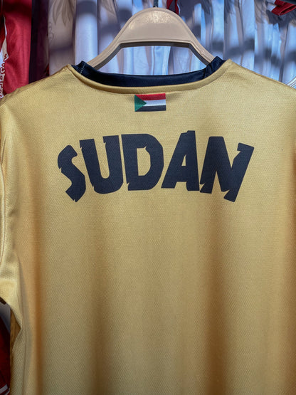 The yellow Sudanese national team T-shirt