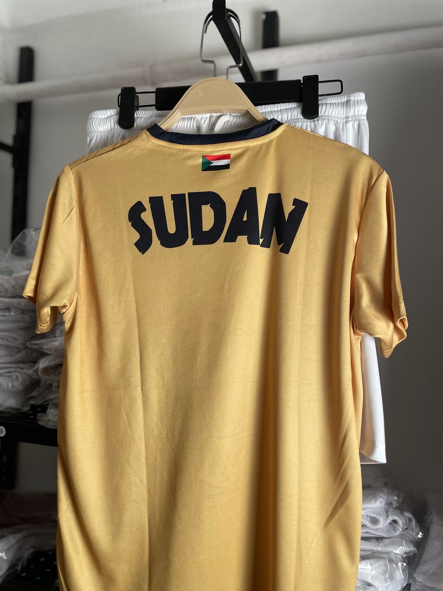 The yellow Sudanese national team T-shirt