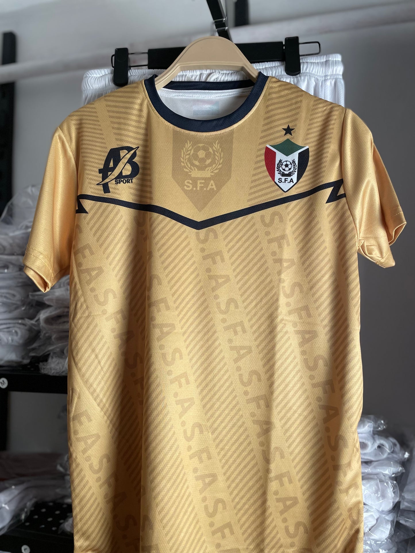 The yellow Sudanese national team T-shirt