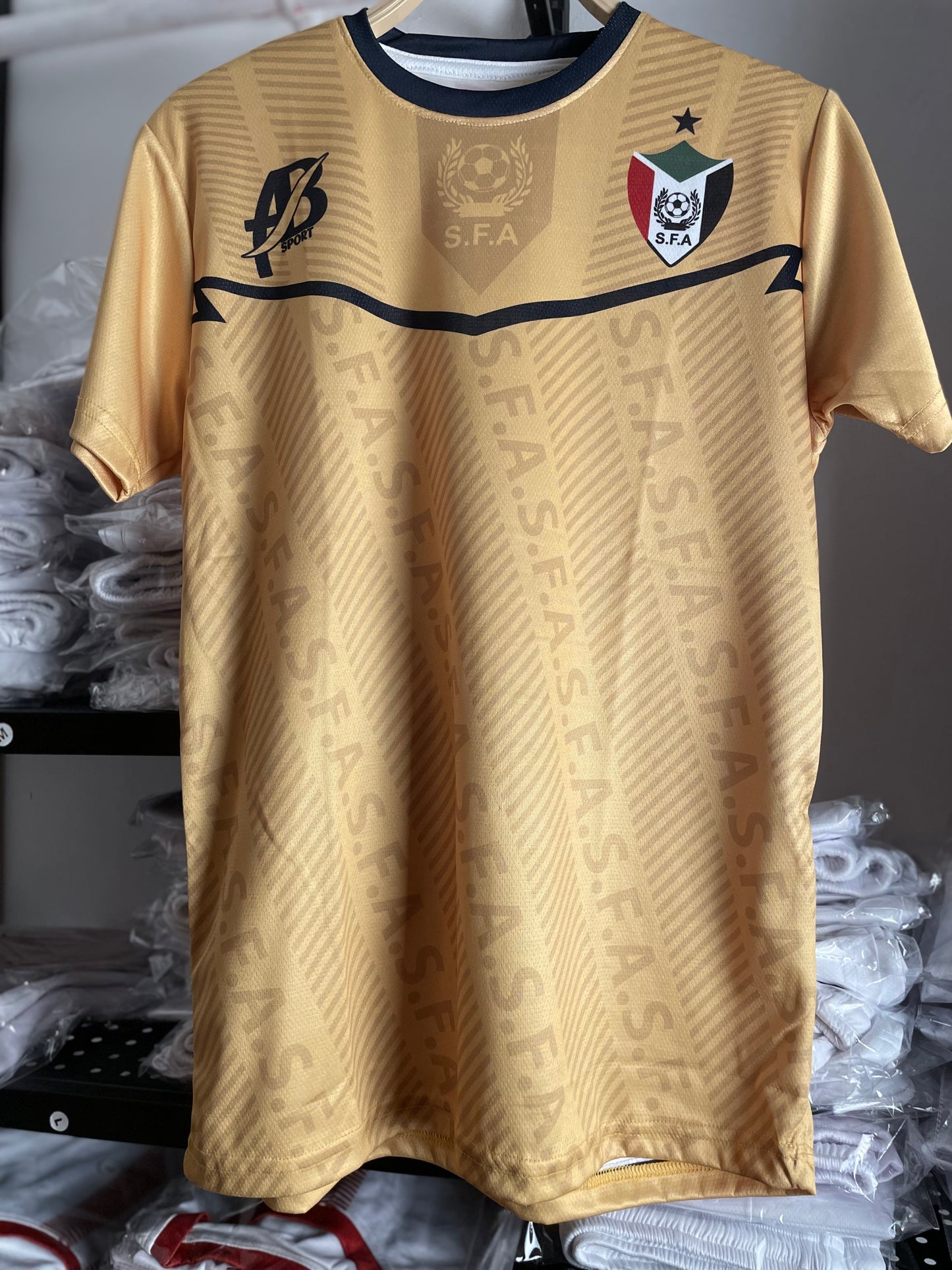 The yellow Sudanese national team T-shirt